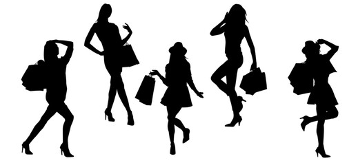 Silhouette of  slim young woman carrying shopping bags.