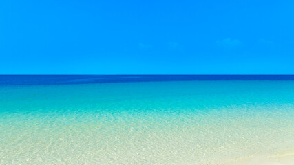 Nature of the beach and sea Summer with sunshine, sandy beaches, clear blue waters sparkling...