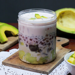 Creamy Avocado Sago Dessert, is a sweet dessert from Hong Kong. Made by puree avocado, sago pearl, and evaporated milk with dice sliced avocado for the topping. Iced Avocado Sago dessert in the jar.