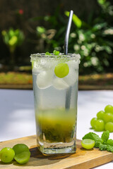 Green Muscat grape mojito cocktail with lime and mint.
