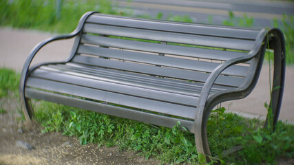 curved wooden bench in the park