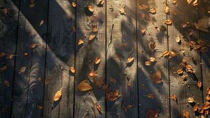 the rustic charm of a top-down view showcasing a dark wood surface adorned with a scattering of autumn leaves