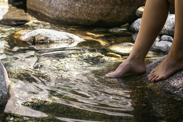 Close-up of a foot in the river water