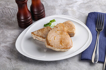 Roasted red tuna steak in the plate