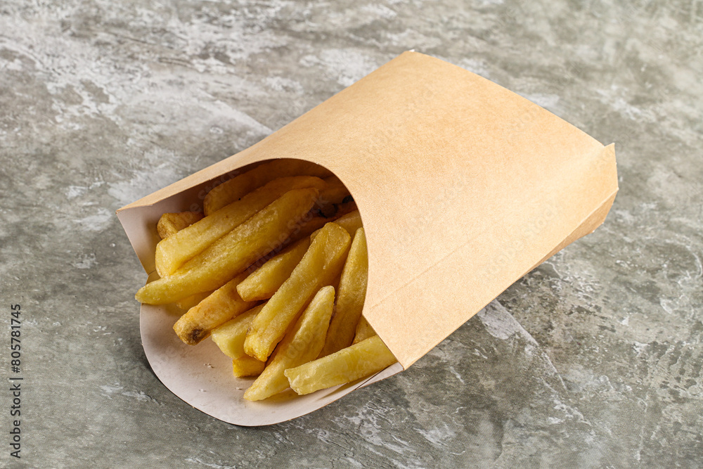 Wall mural Crispy salted French fry potato