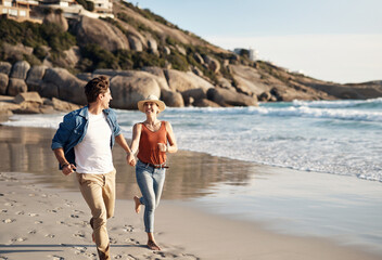 Couple, beach and holding hands in running, happy and holiday for vacation, ocean and cropped shot....