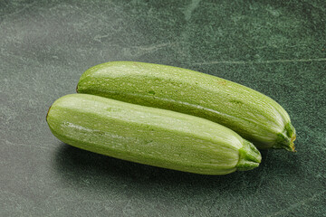Raw green ripe zucchini vegetable