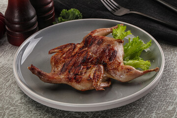 Grilled quail in the plate