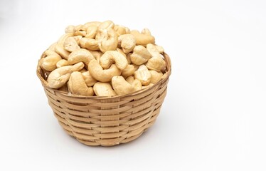Cashew Nut in a Bamboo Basket Isolate on White Background with Copy Space