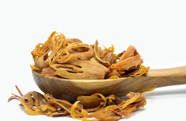 Closeup of Mace or Nutmeg Aril in a Wooden Spoon Isolated on White Background with Copy Space, Also Known as Javitri or or Myristica Fragrans