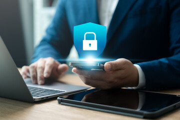 Cybersecurity data protection, businessman using laptop and smartphone internet network security, protect business financial transaction data from cyber attack, user private data security encryption.