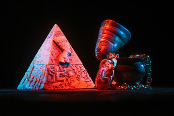 Bust of Nefertiti on the table on the dark background.Ancient Egypt concept background.