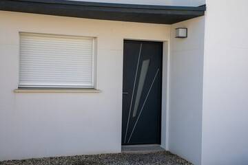 aluminum black facade modern new house front door entrance of white home building