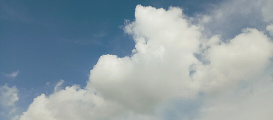 The wide view of the blue sky and thick white clouds is enchanting