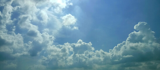 The wide view of the blue sky and thick white clouds is enchanting