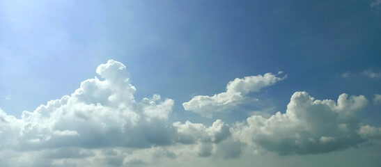 The wide view of the blue sky and thick white clouds is enchanting