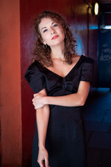 Naklejka premium Relaxed caucasian woman looking at camera in corridor.