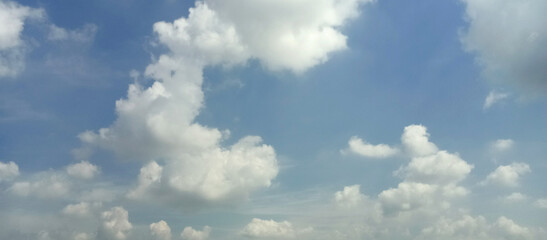 The wide view of the blue sky and thick white clouds is enchanting