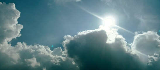 The wide view of the blue sky and thick white clouds is enchanting