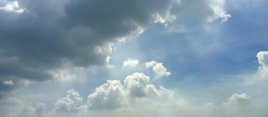 The wide view of the blue sky and thick white clouds is enchanting
