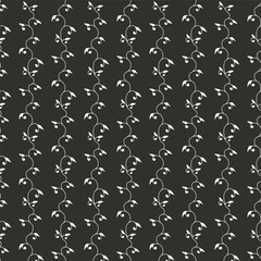 Monochrome eamless pattern with white wild flowers silhouettes on black background. Vintage ditsy floral repeat pattern.