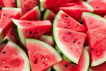 Heap of fresh sliced watermelon as textured background