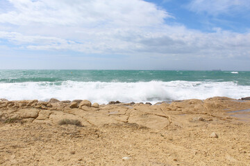beach and sea,natural background texture sky, sea and stone, Mediterranean coast in Spain, waves on the sea, 