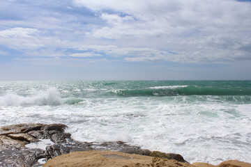 beach and sea,natural background texture sky, sea and stone, Mediterranean coast in Spain, waves on the sea, 