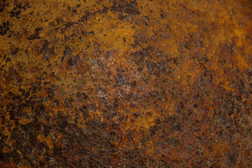 The texture of a metal surface covered with porous rust.