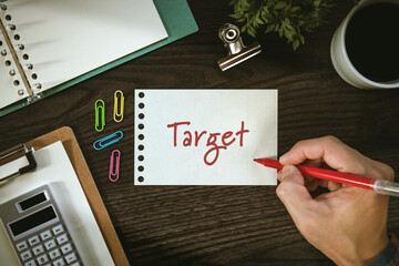 There is notebook with the word Target. It is as an eye-catching image.