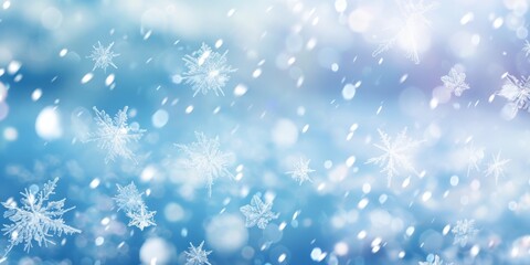 Winter background with falling snowflakes of snow with blur effect