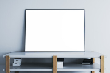 Modern table or tv shelf with items and blank white mock up banner leaning on concrete wall, place for your advertisement. 3D Rendering.