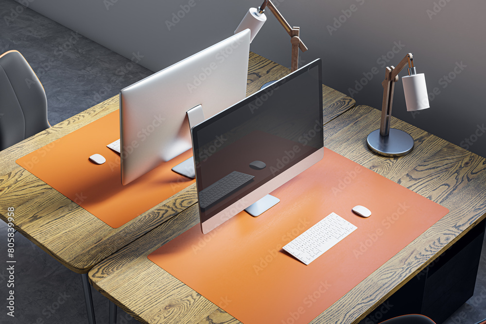 Poster Close up and above view of designer office desk with mock up computer display on wooden desk, rug, lamp and other items. Mock up, 3D Rendering.