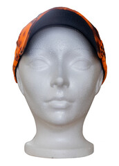 Styrofoam mannequin head of a woman wear ann orange cap isolated on a transparent background.
