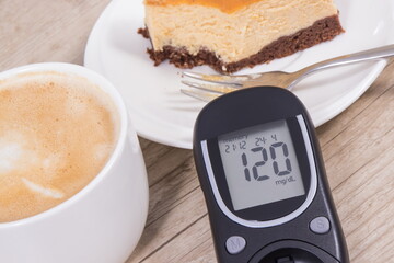 Glucometer with high result sugar level, portion of sweet cheesecake and cup of coffee with milk....