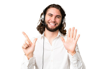 Telemarketer man working with a headset over isolated chroma key background counting seven with...