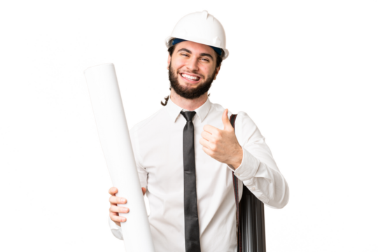 Young architect man with helmet and holding blueprints over isolated chroma key background giving a thumbs up gesture