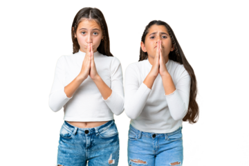 Friends girls holding gift and a birthday cake over isolated chroma key background keeps palm together. Person asks for something