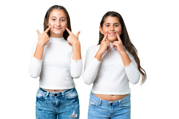 Friends girls holding gift and a birthday cake over isolated chroma key background smiling with a happy and pleasant expression