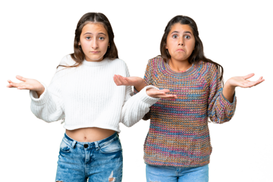 Friends girls over isolated chroma key background having doubts and with confuse face expression