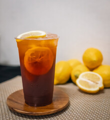Lime Iced Tea Thai drink, and garnished with lime slices in glass.