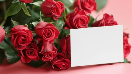 mockup of a white card beside red rose bouquet, soft pastel tones 