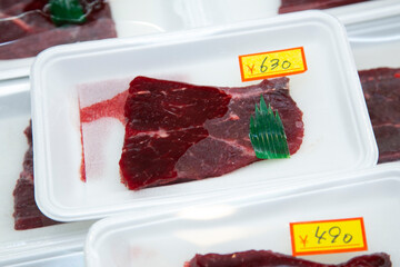 Cut of whale meat at an Osaka fish market in Japan.