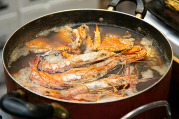 Japanese seafood and shrimp soup at a street food market in Osaka, Japan.