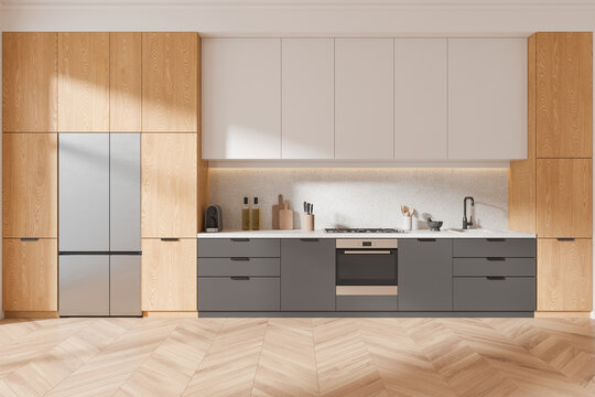 Luxury home kitchen interior with cooking cabinet and kitchenware, fridge