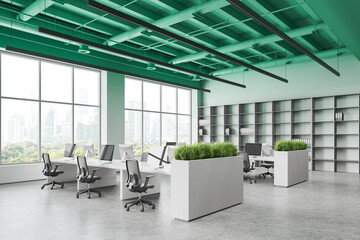 Green office coworking interior with table and pc computers, panoramic window