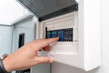 A technician works with a demo kit of the smart home system