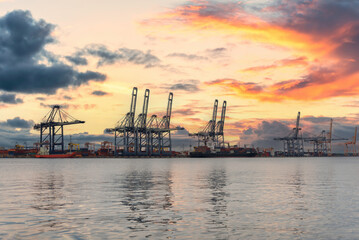 Obraz premium Logistic transportation sea freight, Cargo ship Cargo container in deep sea port at industrial estate for import export around in the world