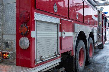 A red fire truck with a retractable ladder. Equipment for rescuing people in case of fire. The...