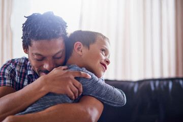 Father, hug and child in home for love, quality time and happy for care in living room. Black man,...